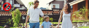 Family walking in backyard with no pests sign
