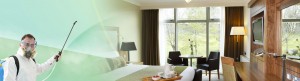 Person in protective suit disinfecting hotel room