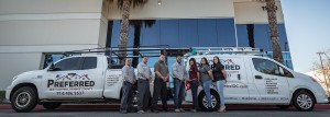 Pest control crew with branded trucks