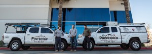 Pest control trucks and three technicians