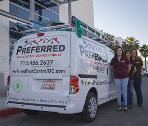 Preferred Pest Control van with three technicians
