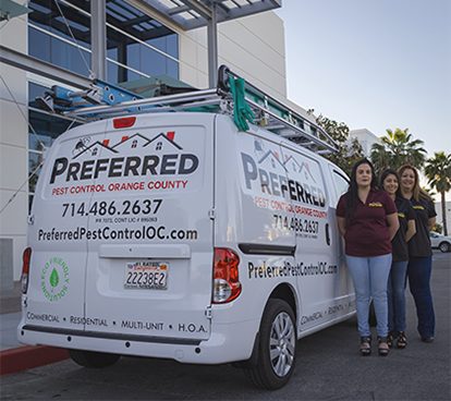 Pest control van with three uniformed technicians Pest control van with three uniformed technicians