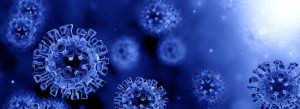 Blue coronavirus particles on dark background
