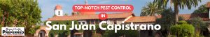 Spanish mission building with pest control banner