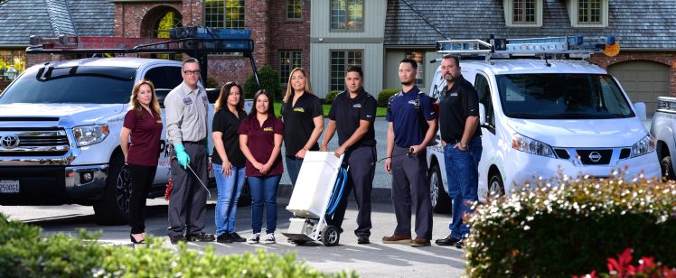 Home service team with vans outside house