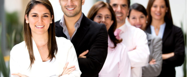 Smiling diverse business team with crossed arms