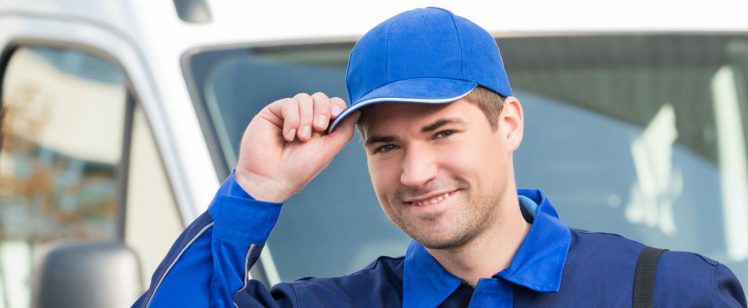 Delivery driver tipping cap in front of van