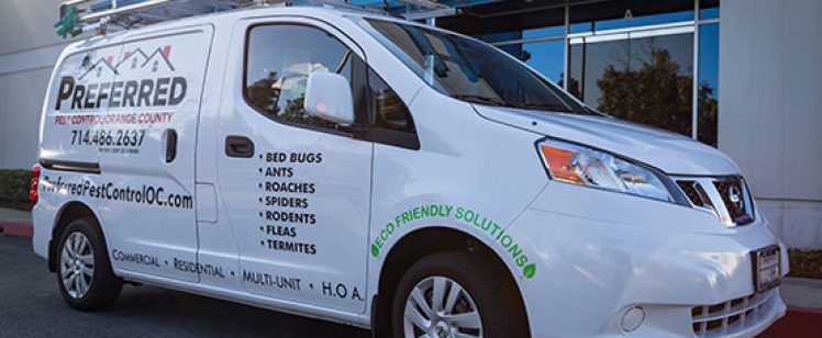 White pest control service van with ladder